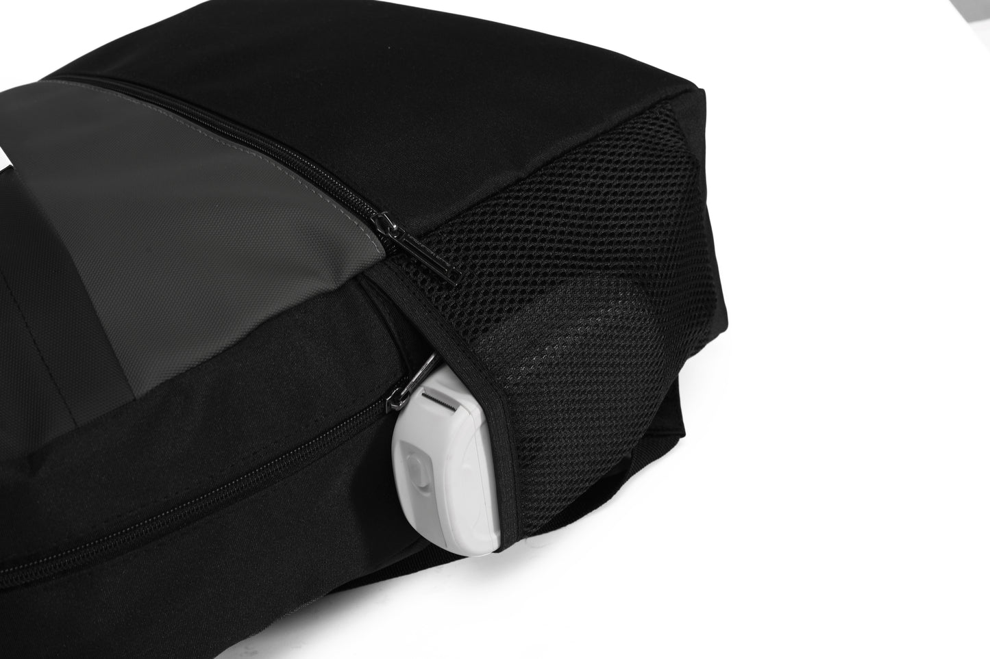 Black backpack with a white zipper pull on a white background