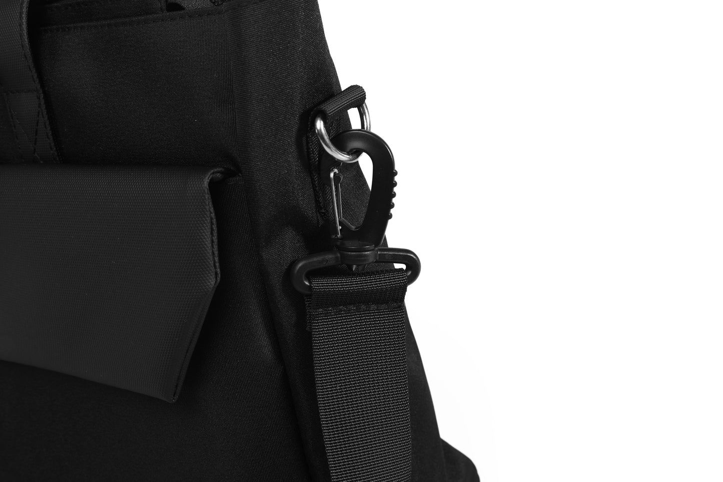Close-up of a black backpack with a strap on a white background
