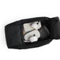 Black travel pouch with white earbuds inside on a white background