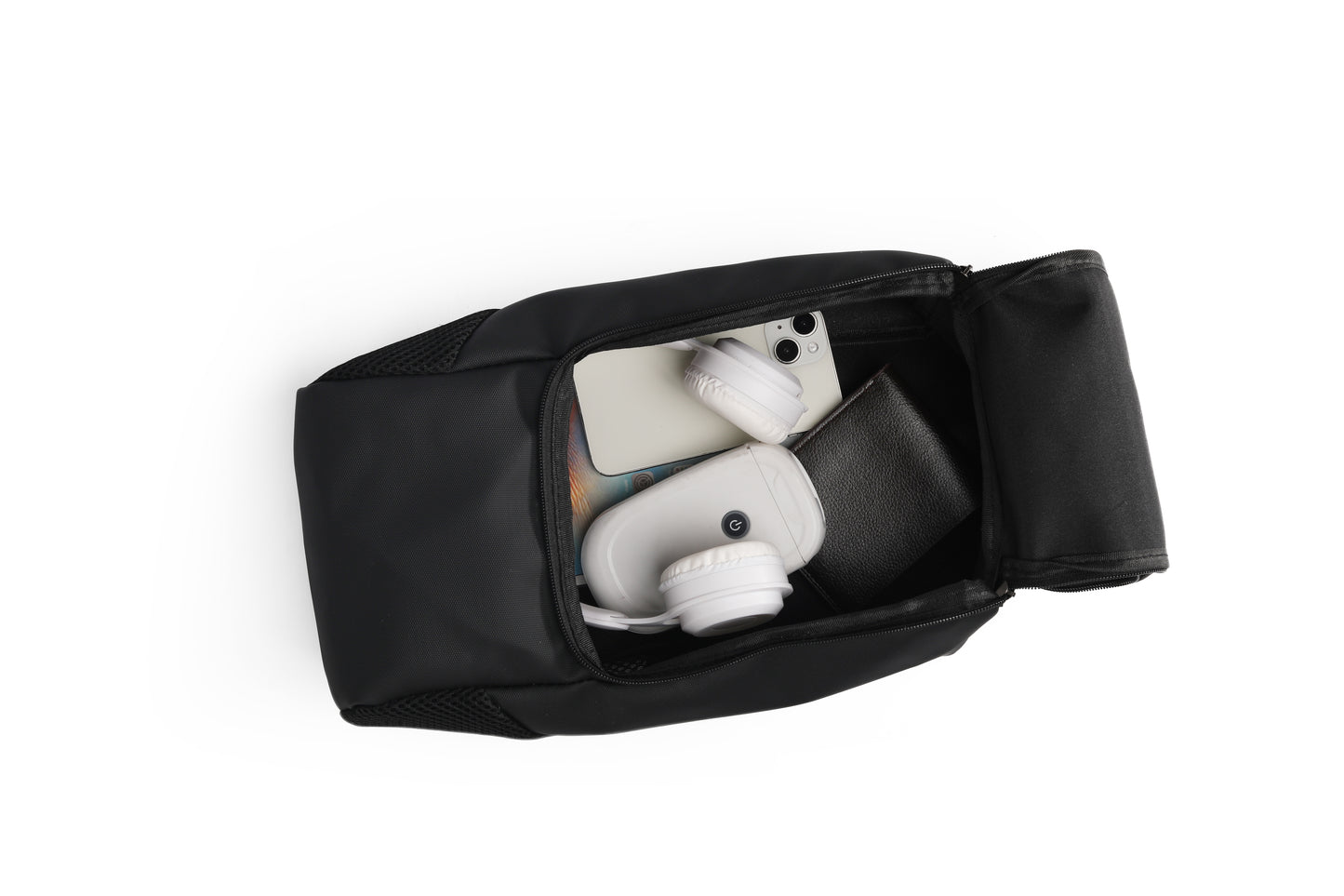 Black travel pouch with white earbuds inside on a white background