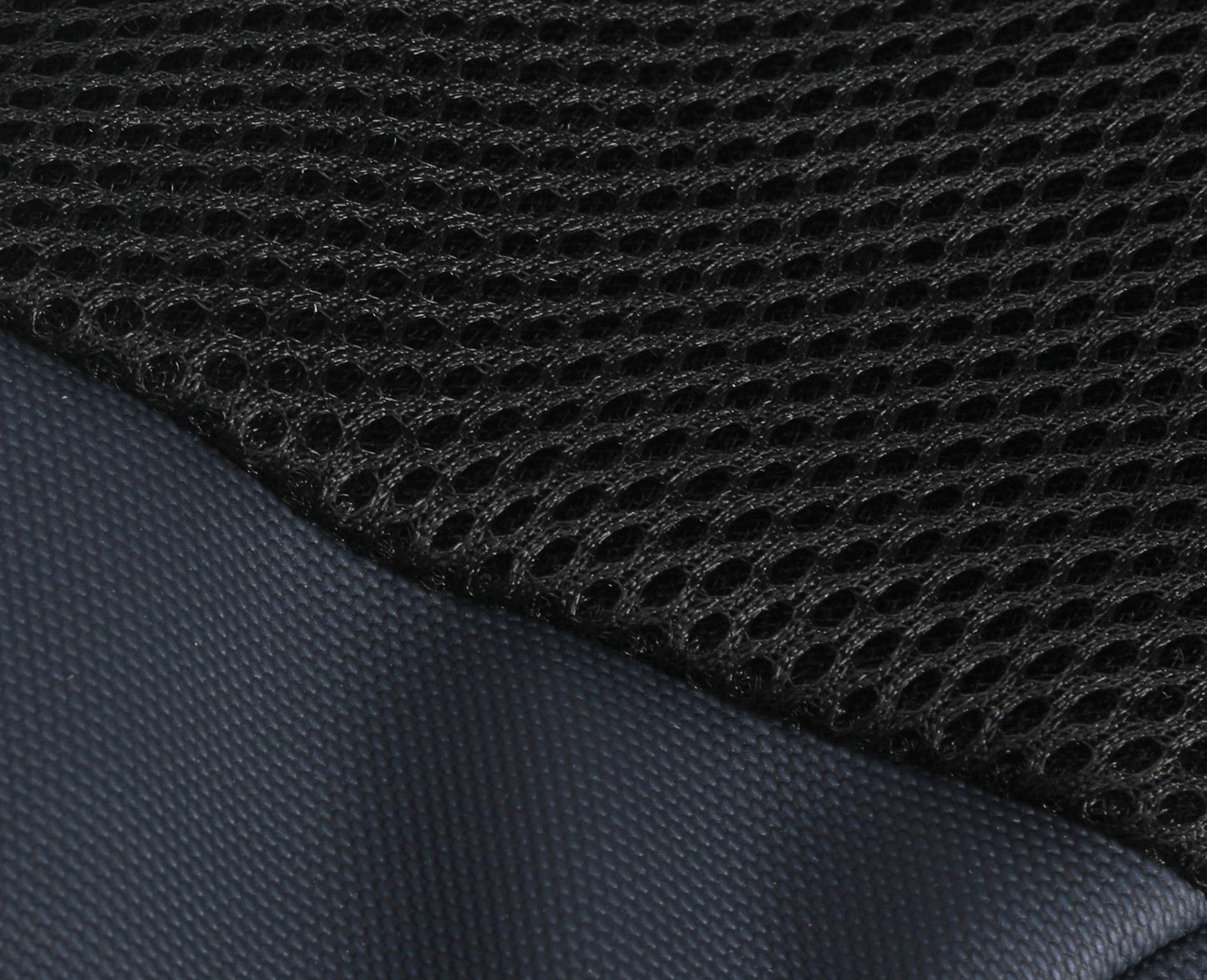 Close-up of black textured fabric with a grid pattern