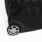 Close-up of a black suitcase wheel on a white background